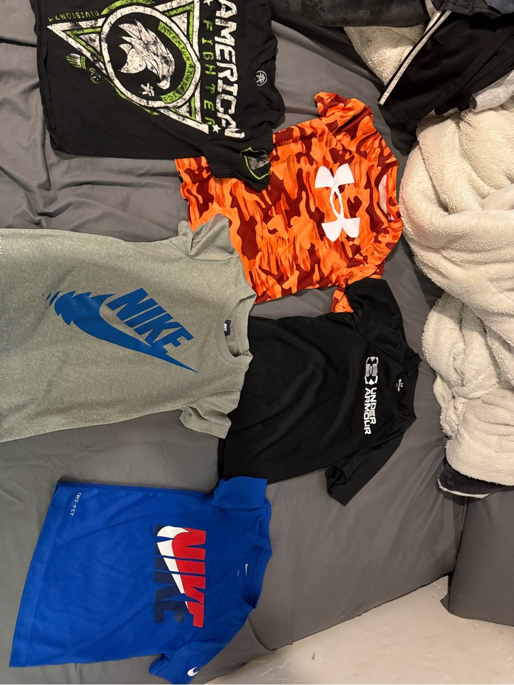 Under Armour, Nike, and American Fighter tshirts. 11 total, my son hardly wore